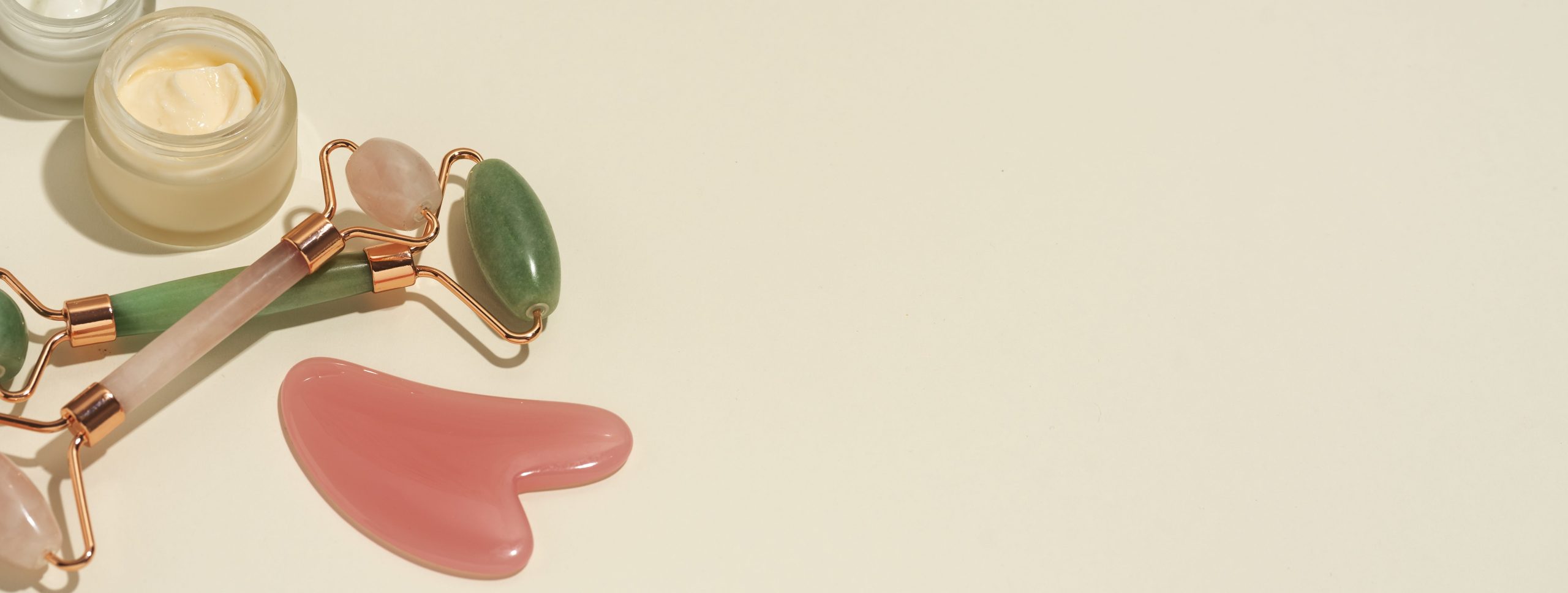 horizontal banner cosmetic product with jade roller gua sha